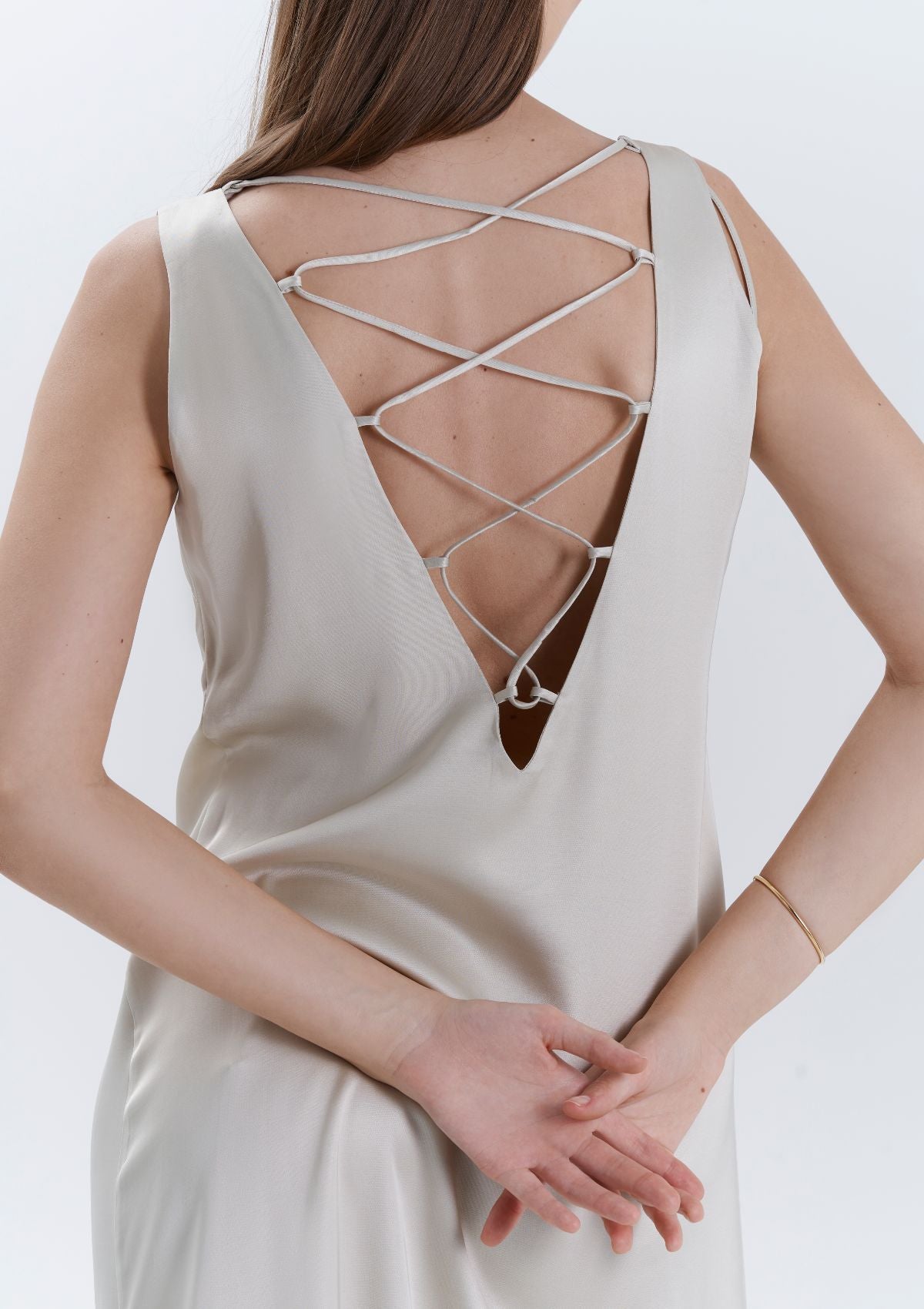 A stunning low back beige dress by Silk & tonic
