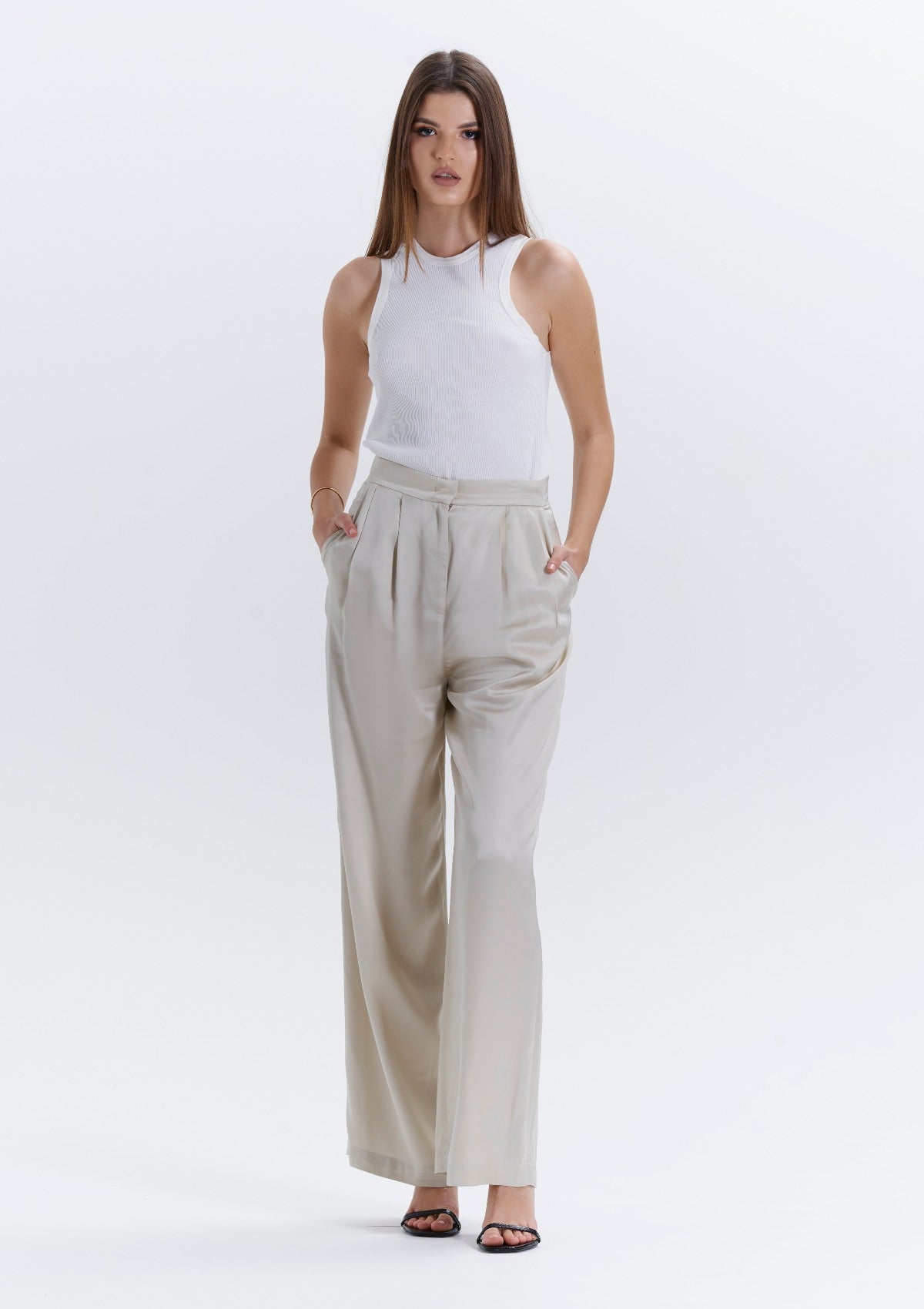 trending loose fit beige pleated women's pants by Silk & tonic fashion brand