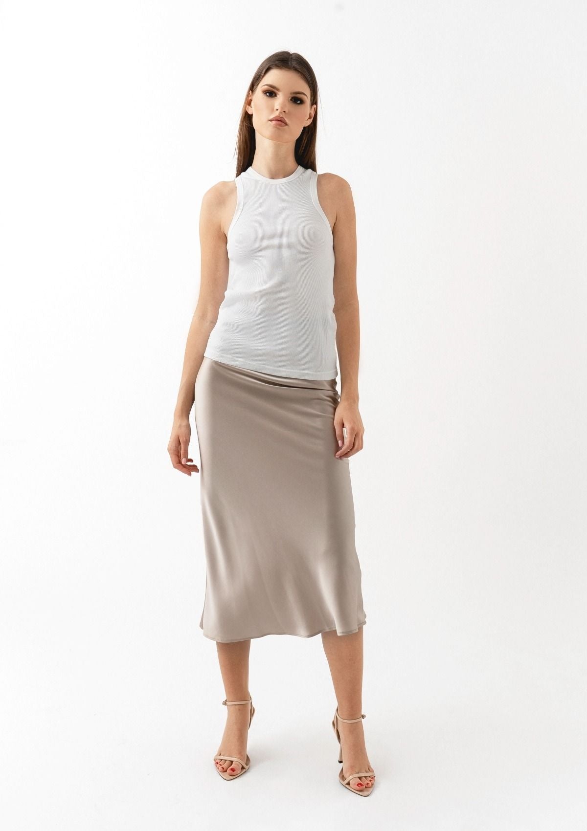 A neutral beige midi silk slip skirt by Silk & tonic fashion brand
