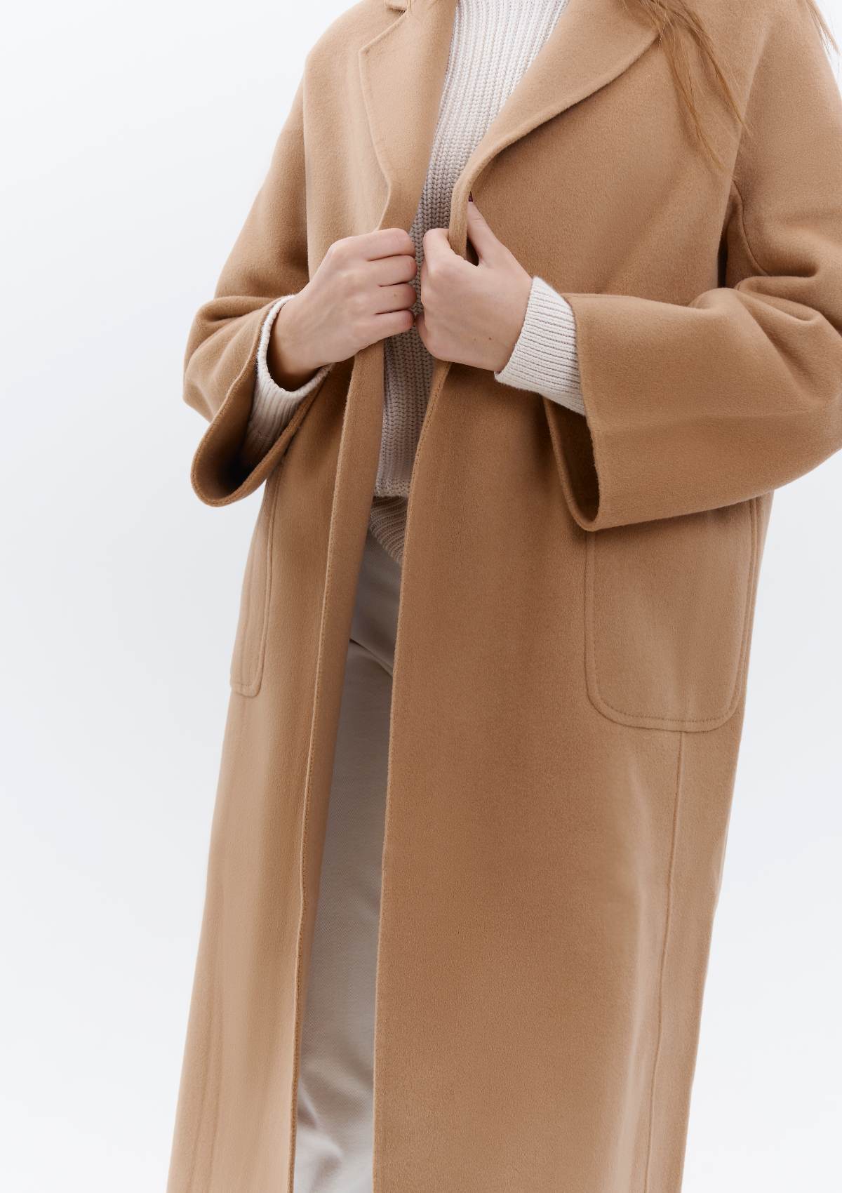 details of an exceptional quality cashmere coat in camel tone